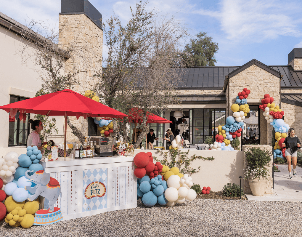 Epic Party Team open house courtyard with balloon installations and event bars