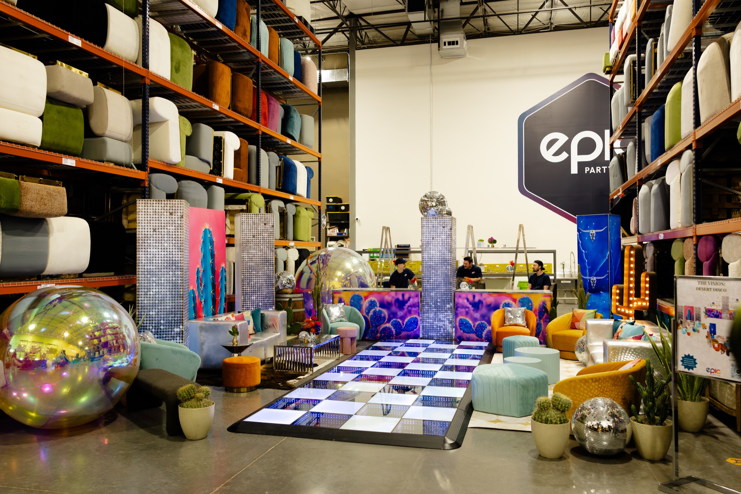Epic Party Team Phoenix showroom with event lounge furniture, bars, and an illuminated dance floor