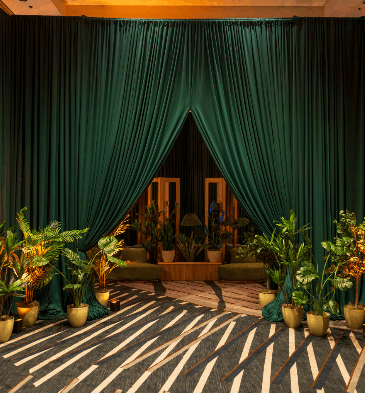 Emerald green pipe and drape installation